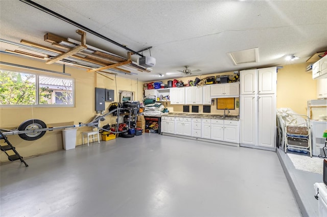 2807 Coral Way, Punta Gorda, FL 33950 - garage featuring a garage door opener, electric panel, and a sink