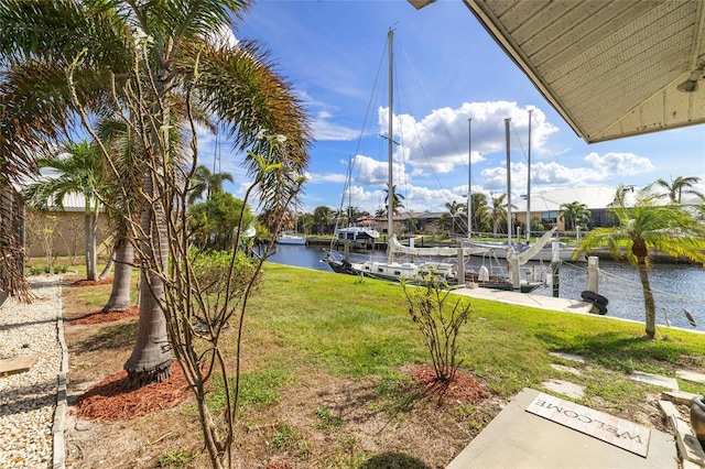 2807 Coral Way, Punta Gorda, FL 33950 - view of green lawn featuring a water view and a dock