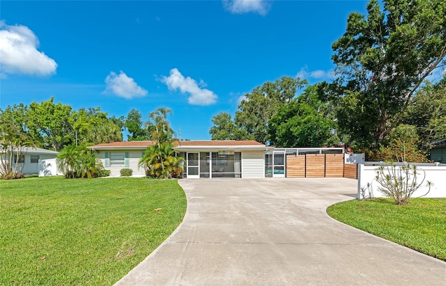 5948 Mirror Lake Rd, Sarasota, FL 34238 - single story home featuring a sunroom and driveway