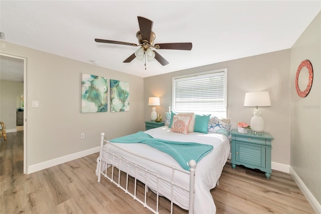 5948 Mirror Lake Rd, Sarasota, FL 34238 - bedroom featuring light wood-type flooring and a ceiling fan