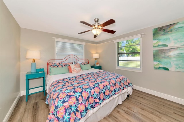 5948 Mirror Lake Rd, Sarasota, FL 34238 - bedroom featuring wood finished floors and a ceiling fan