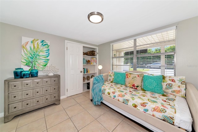 5948 Mirror Lake Rd, Sarasota, FL 34238 - bedroom with light tile patterned flooring and baseboards