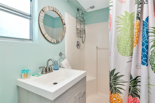 5948 Mirror Lake Rd, Sarasota, FL 34238 - bathroom featuring a shower with shower curtain and vanity
