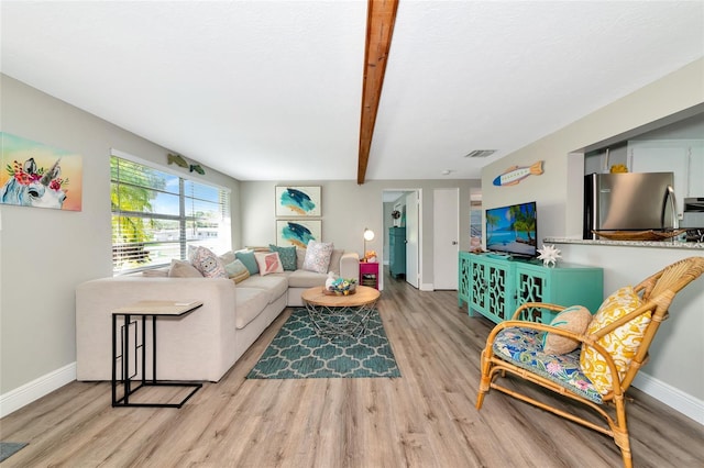 5948 Mirror Lake Rd, Sarasota, FL 34238 - living area featuring light wood-type flooring and beamed ceiling