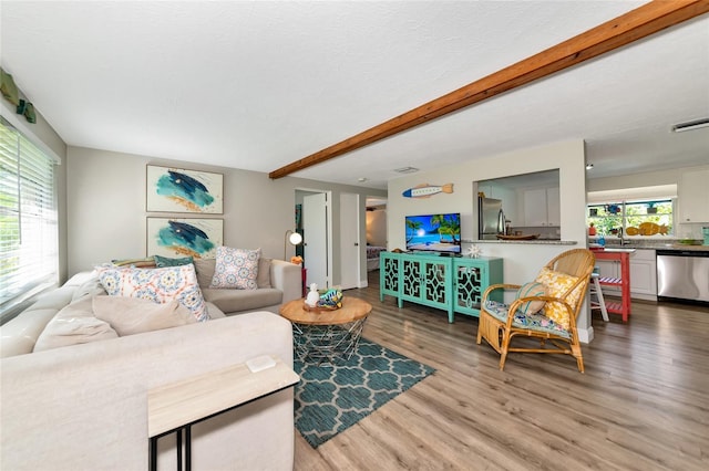 5948 Mirror Lake Rd, Sarasota, FL 34238 - living room with wood finished floors and beamed ceiling