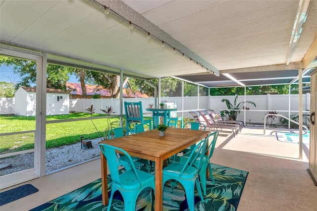 5948 Mirror Lake Rd, Sarasota, FL 34238 - sunroom / solarium featuring outdoor dining space