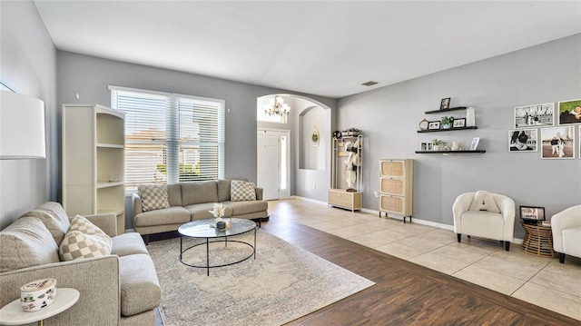 8804 Founders Cir, Palmetto, FL 34221 - living area with arched walkways and wood finished floors