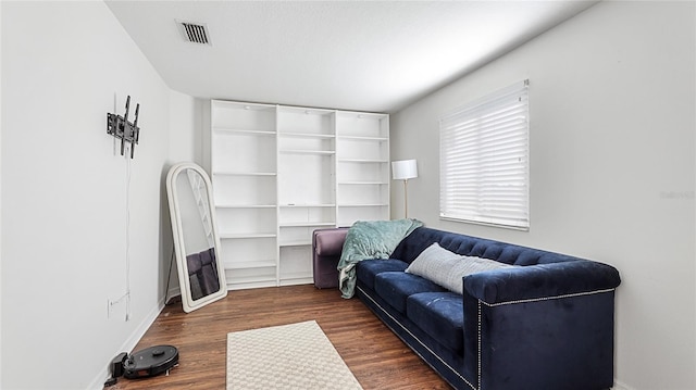 8804 Founders Cir, Palmetto, FL 34221 - living area featuring dark wood-style flooring and baseboards