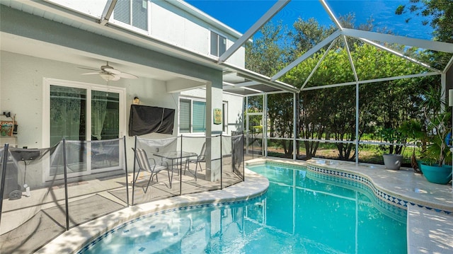 8804 Founders Cir, Palmetto, FL 34221 - swimming pool with a patio, a ceiling fan, and glass enclosure