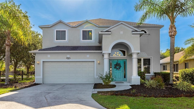 8804 Founders Cir, Palmetto, FL 34221 - view of front of home featuring stucco siding, an attached garage, and concrete driveway