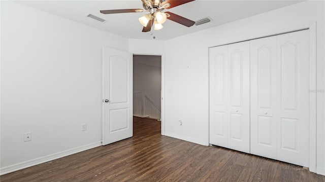 8804 Founders Cir, Palmetto, FL 34221 - unfurnished bedroom with dark wood-style flooring, a closet, and ceiling fan