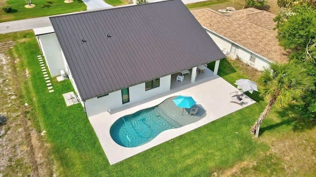 289 Long Meadow Ln, Rotonda West, FL 33947 - swimming pool with a patio area and a yard