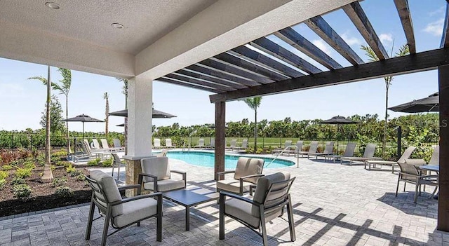 8689 Daybreak St, Sarasota, FL 34241 - view of patio featuring a community pool and a pergola