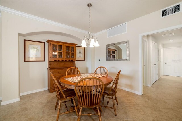6923 Grand Estuary Trl Unit 101, Bradenton, FL 34212 - dining room with a chandelier, ornamental molding, and light tile patterned floors