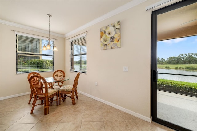 6923 Grand Estuary Trl Unit 101, Bradenton, FL 34212 - dining area with ornamental molding, a chandelier, light tile patterned floors, and a water view