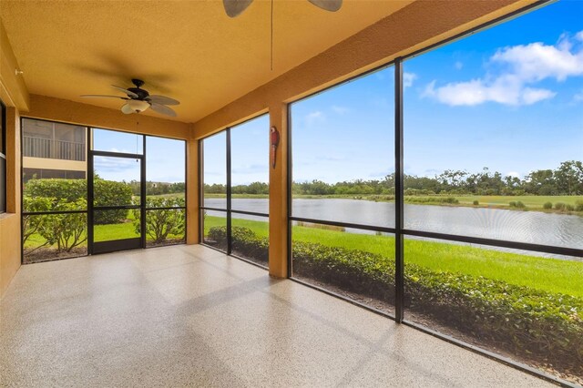 6923 Grand Estuary Trl Unit 101, Bradenton, FL 34212 - unfurnished sunroom with a ceiling fan, a water view, and speckled floor