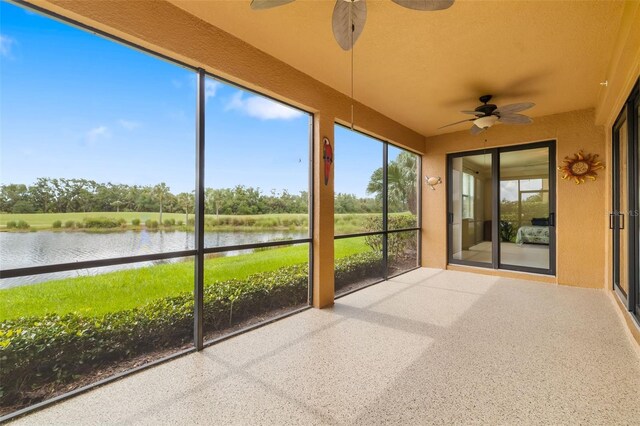 6923 Grand Estuary Trl Unit 101, Bradenton, FL 34212 - unfurnished sunroom with ceiling fan and a water view