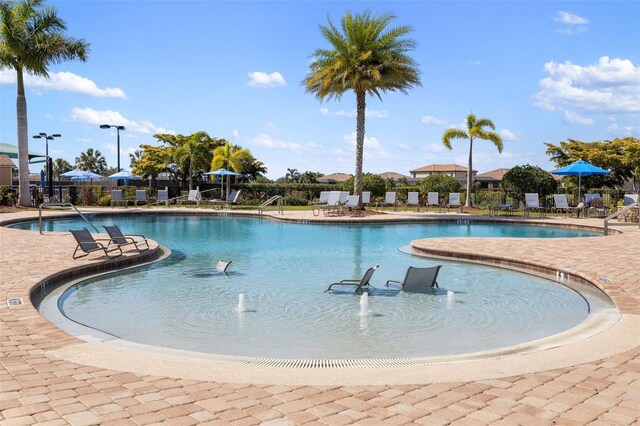 6923 Grand Estuary Trl Unit 101, Bradenton, FL 34212 - community pool featuring a patio area