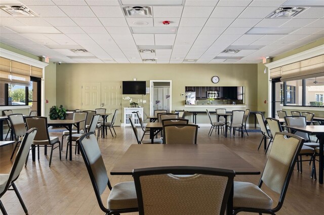 6923 Grand Estuary Trl Unit 101, Bradenton, FL 34212 - dining area with light wood-style floors and a paneled ceiling