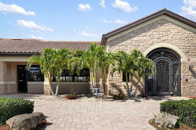 6923 Grand Estuary Trl Unit 101, Bradenton, FL 34212 - view of front facade with stone siding