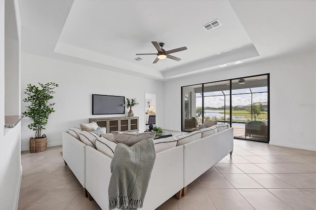 15344 Serene Shores Loop, Lakewood Ranch, FL 34211 - living area with a raised ceiling, light tile patterned floors, and ceiling fan