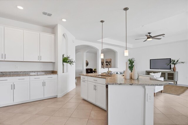 15344 Serene Shores Loop, Lakewood Ranch, FL 34211 - kitchen featuring light tile patterned floors, white cabinets, open floor plan, and recessed lighting