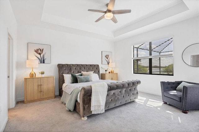 15344 Serene Shores Loop, Lakewood Ranch, FL 34211 - bedroom featuring a raised ceiling, light carpet, and ceiling fan