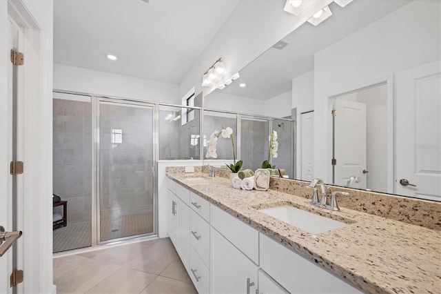 15344 Serene Shores Loop, Lakewood Ranch, FL 34211 - bathroom featuring double vanity, tile patterned floors, a shower stall, and recessed lighting
