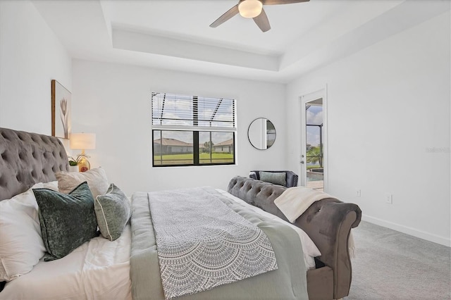 15344 Serene Shores Loop, Lakewood Ranch, FL 34211 - bedroom featuring carpet flooring, a raised ceiling, and a ceiling fan