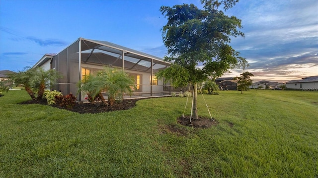 15344 Serene Shores Loop, Lakewood Ranch, FL 34211 - view of grassy yard with glass enclosure