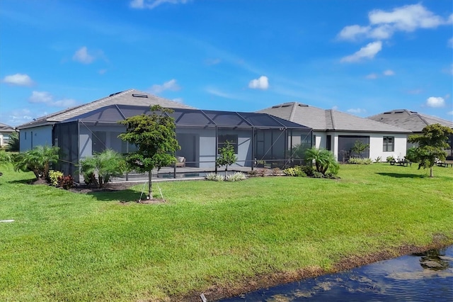 15344 Serene Shores Loop, Lakewood Ranch, FL 34211 - back of house with a lawn and glass enclosure