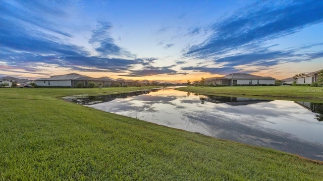 15344 Serene Shores Loop, Lakewood Ranch, FL 34211 - view of grassy yard with a water view and a residential view