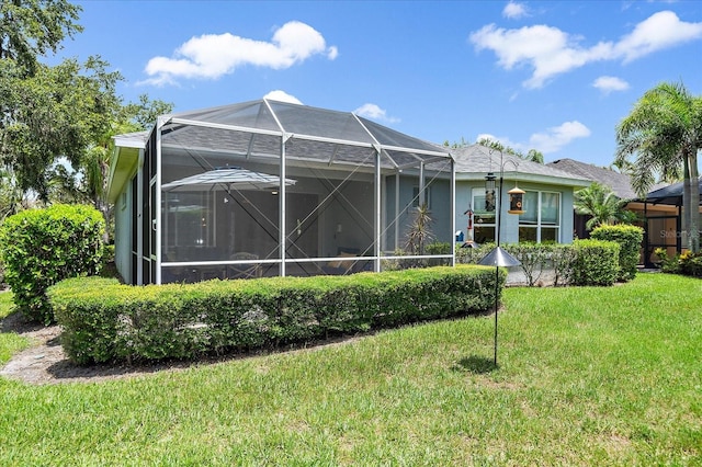 5508 Whitehead St, Bradenton, FL 34203 - back of property featuring a lawn and a lanai