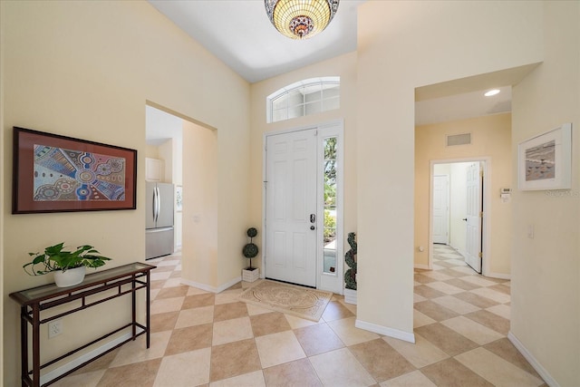 5508 Whitehead St, Bradenton, FL 34203 - entrance foyer featuring a high ceiling, light tile patterned floors, and recessed lighting