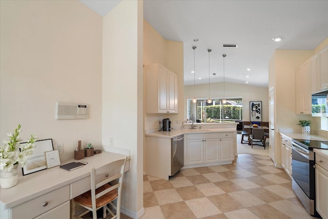 5508 Whitehead St, Bradenton, FL 34203 - kitchen featuring stainless steel appliances, built in desk, hanging light fixtures, vaulted ceiling, and light countertops