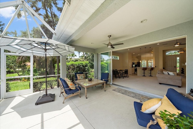5508 Whitehead St, Bradenton, FL 34203 - sunroom / solarium featuring a ceiling fan, an outdoor hangout area, and beamed ceiling