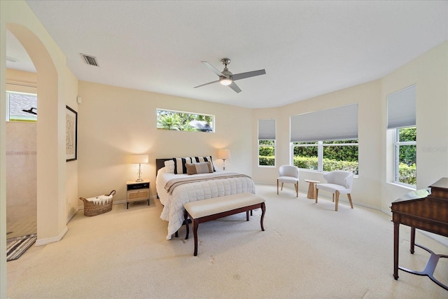 5508 Whitehead St, Bradenton, FL 34203 - bedroom featuring multiple windows, carpet floors, arched walkways, and a ceiling fan