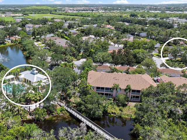 5508 Whitehead St, Bradenton, FL 34203 - aerial view of residential area with a nearby body of water and a tree filled landscape