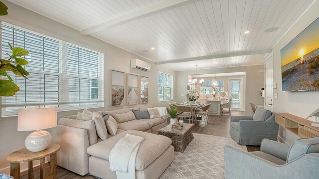4322 Marina View Way, Cortez, FL 34215 - living room with a wall unit AC, a chandelier, light wood finished floors, wooden ceiling with exposed beams, and recessed lighting