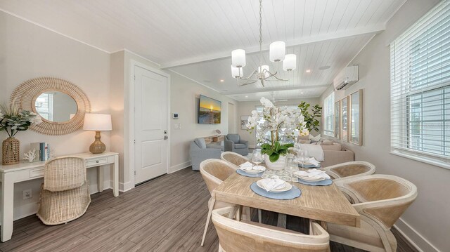 4322 Marina View Way, Cortez, FL 34215 - dining area featuring a wall mounted AC, wood finished floors, a chandelier, wooden ceiling with exposed beams, and baseboards