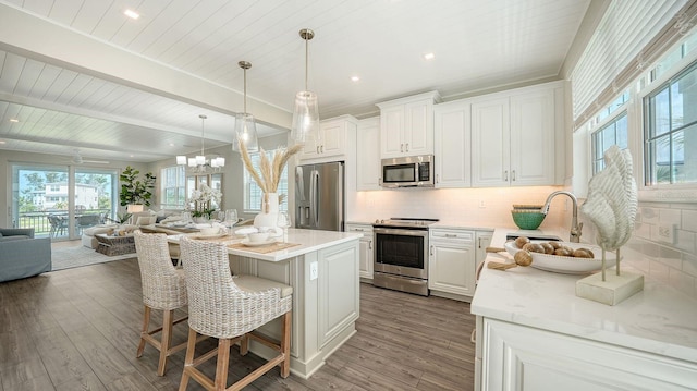 4322 Marina View Way, Cortez, FL 34215 - kitchen with appliances with stainless steel finishes, open floor plan, backsplash, light countertops, and recessed lighting