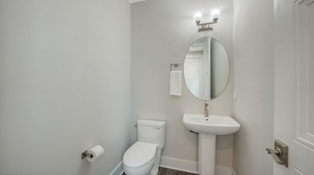 4322 Marina View Way, Cortez, FL 34215 - bathroom with toilet, baseboards, and a sink