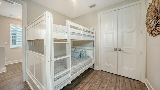4322 Marina View Way, Cortez, FL 34215 - bedroom featuring wood finished floors, baseboards, and a closet