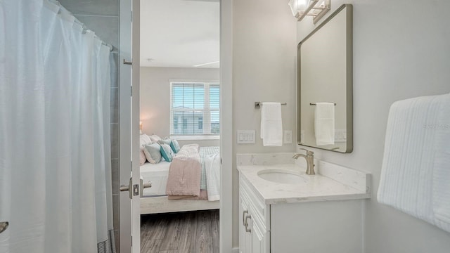 4322 Marina View Way, Cortez, FL 34215 - ensuite bathroom with vanity, wood finished floors, and a shower with shower curtain