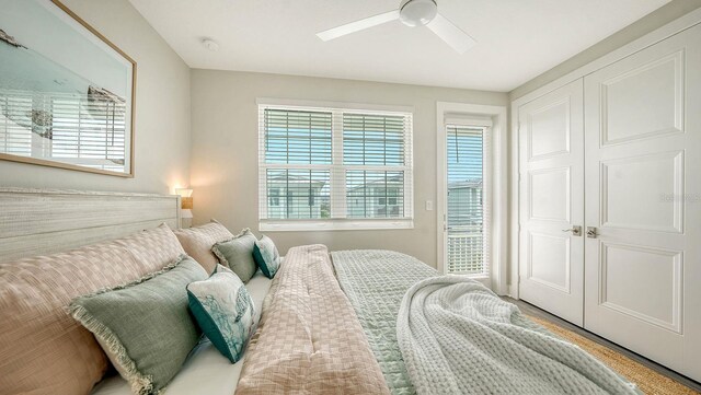 4322 Marina View Way, Cortez, FL 34215 - bedroom featuring multiple windows, a ceiling fan, and a closet