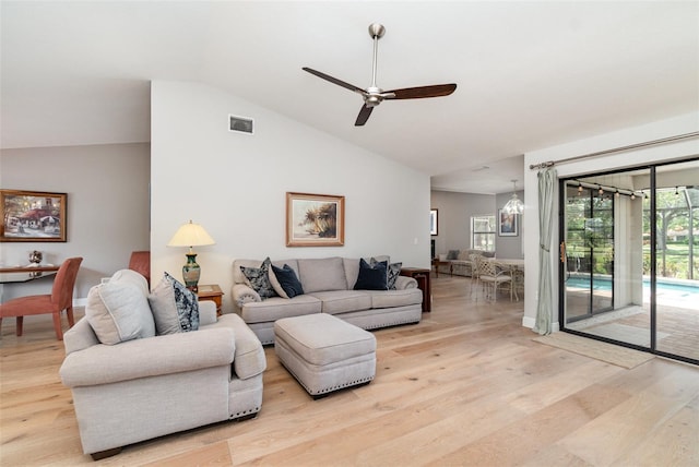 4353 Indian Point Trl, Sarasota, FL 34238 - living area featuring light wood finished floors, vaulted ceiling, and ceiling fan