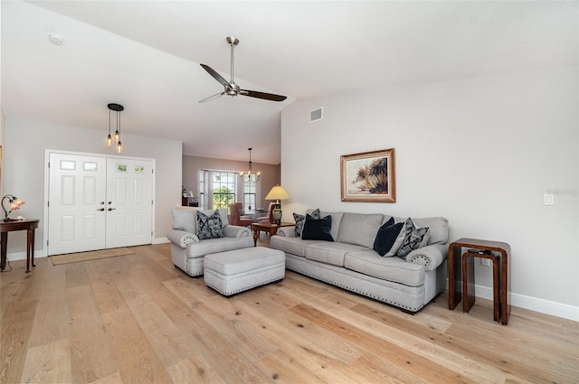 4353 Indian Point Trl, Sarasota, FL 34238 - living area featuring light wood finished floors, a ceiling fan, a chandelier, and lofted ceiling