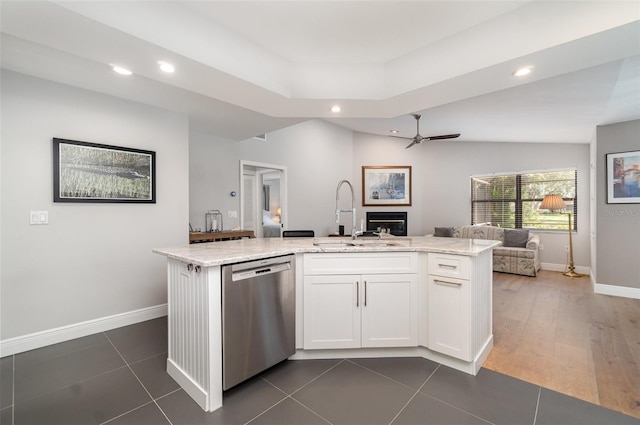 4353 Indian Point Trl, Sarasota, FL 34238 - kitchen with stainless steel dishwasher, open floor plan, a ceiling fan, recessed lighting, and white cabinetry