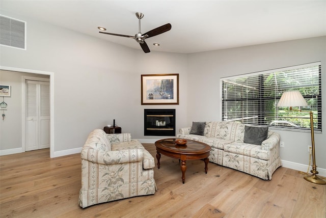 4353 Indian Point Trl, Sarasota, FL 34238 - living area featuring ceiling fan, light wood finished floors, recessed lighting, and a glass covered fireplace