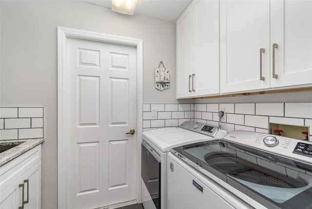 4353 Indian Point Trl, Sarasota, FL 34238 - laundry area with washing machine and clothes dryer and cabinet space